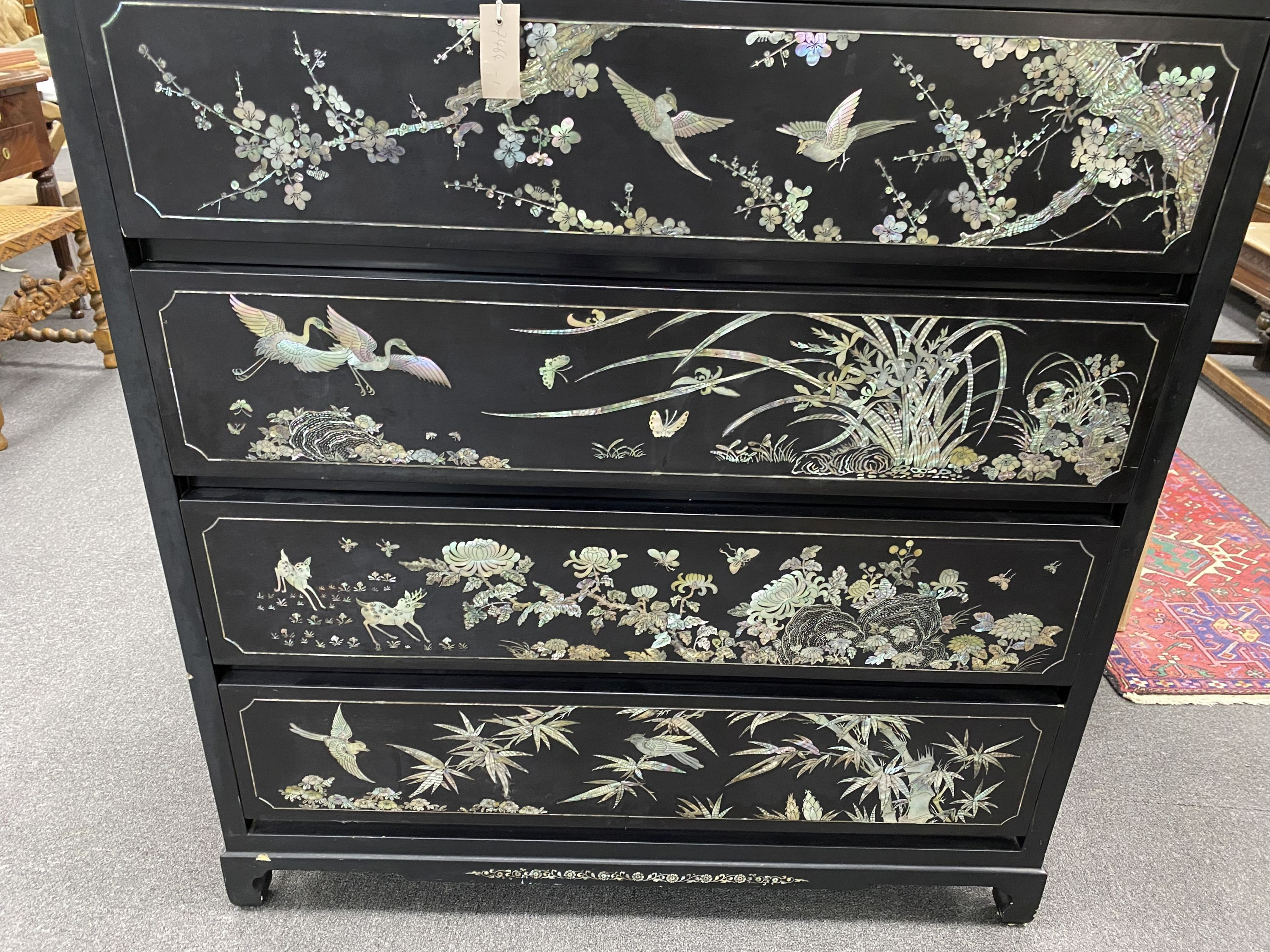 A Japanese black lacquer and mother of pearl inlaid kimono chest, width 104cm, depth 52cm, height 128cm